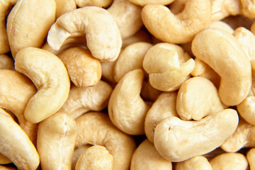 Cashew nut heap food texture background, macro shot. Cashew pile, closeup shot
