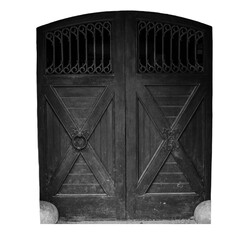 Wooden door with iron fittings on white background. Typical architecture of medieval Europe.
