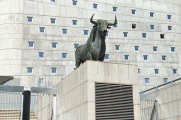 Statue of a bull on the facade of the building of bullring. The bull is an iconic symbol of Spain