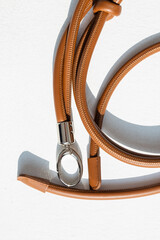 Genuine leather bag strap or handbag handle in brown color isolated on white background