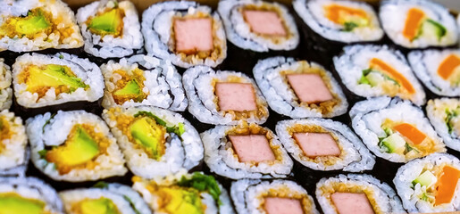 Sushi Roll Platter on wood background. Salmon sushi set, serving food for restaurant, menu, advert or package, close up, selective focus