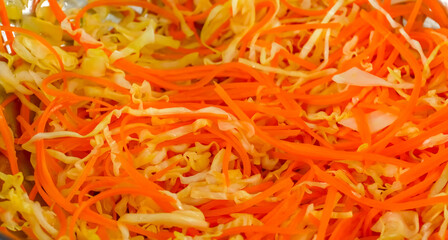 Healthy fresh meal cooking, chopped cabbage, carrot. Homemade vegetables preparation for menu, advert or package, close up, selective focus.