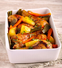 Baked chicken drumsticks with vegetables