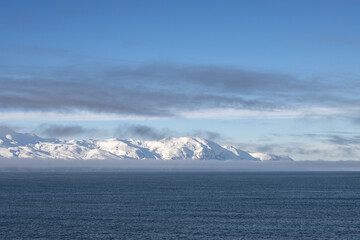Atlantic ocean and snowy mountains, North Iceland