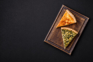 Delicious crispy quiche cut into slices with cheese, broccoli, tomatoes