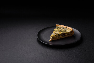 Delicious crispy quiche cut into slices with cheese, broccoli, tomatoes