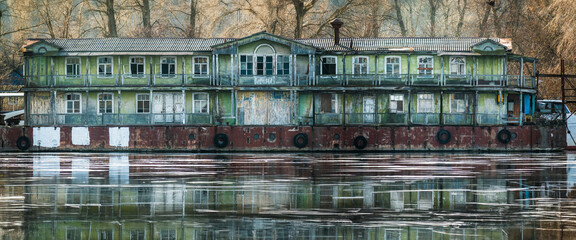 Creepy old house on a barge. - 732742861