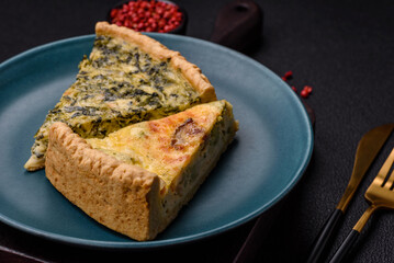 Delicious crispy quiche cut into slices with cheese, broccoli, tomatoes