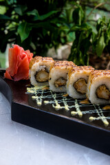 Crab Ebi Uramaki served on a black wooden plate, avocado, cucumber, lump crab meat, sushi menu, social media post, food photography, fine dining, Japanese food, purple background
