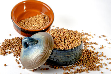 Bowl with raw uncooked buckwheat, Raw Buckwheat Pile, Dry Buck Wheat Grains, Uncooked Buckwheat
