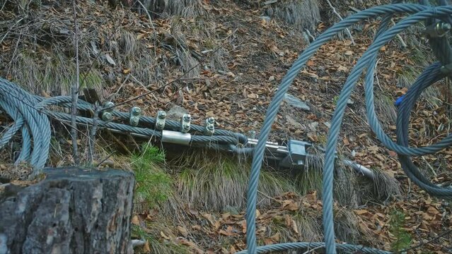 Rockslide Prevention Rockfall Safety Netting Supported by Metal Steel Wire Cable Anchored in Ground of Mountain Hill Slope