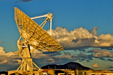 The size of each of the Radio telescopes 25 meters (82 feet) in diameter is dramatized by comparing...