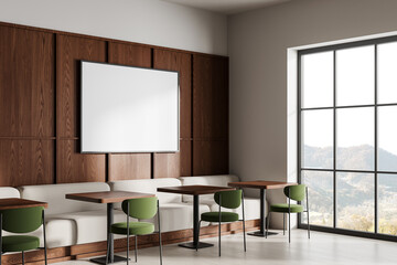 Modern restaurant interior with chairs and table, panoramic window. Mockup frame