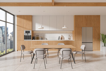 Fototapeta premium Stylish home kitchen interior with eating table and cabinet, panoramic window