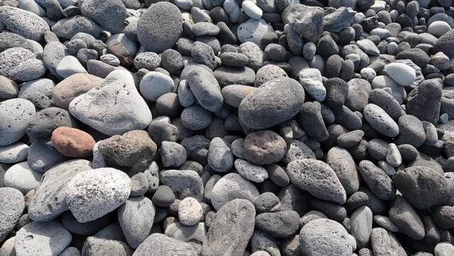 Beach rocks bottom on sunny day