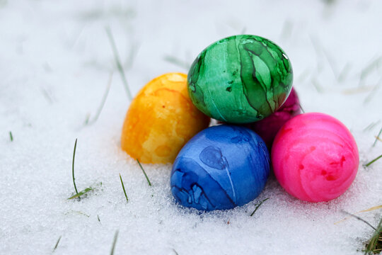 Colorful easter eggs in snow