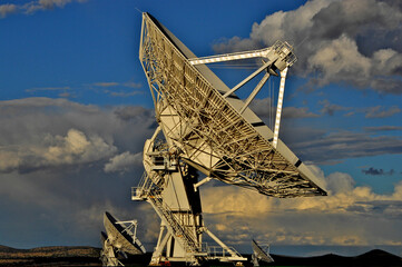 Late afternoon sun illuminates 3 Radio Telescopes on the Plains of San Agustin, New Mexico 