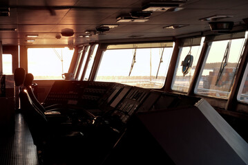 Old Abandoned Wheelhouse Bridge Of The Container Vessel. View At The Sunset From The Merchant Ship