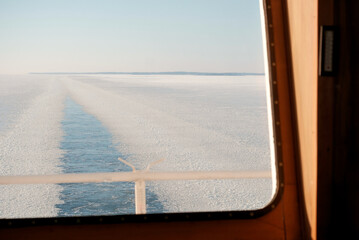 Frozen Water Surface Of The International Shipping Fairway Route. Winter Navigation In the Arctic Area Region