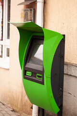 green ATM on the street