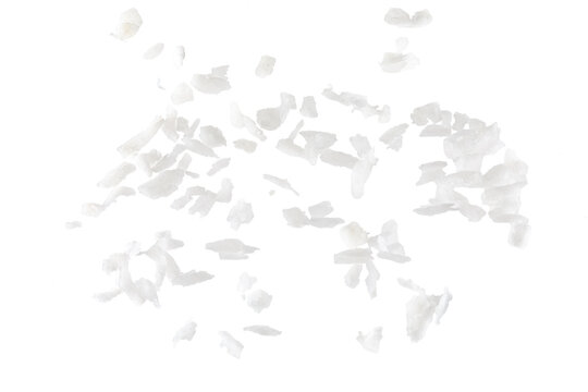 Fresh coconut flakes on white background, top view. Close-up