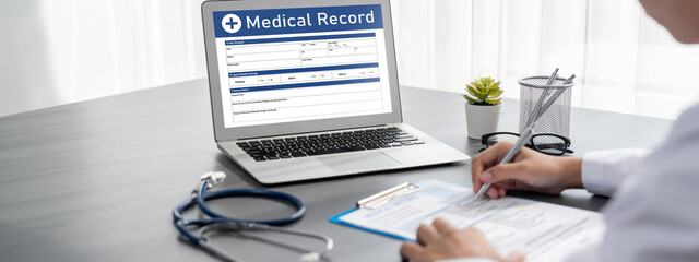 Doctor carefully review detailed medical report on laptop and diagnosing illness for effective...