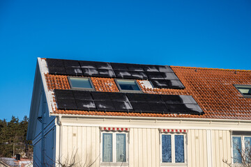 Solar panels on the roof of a house at winter.