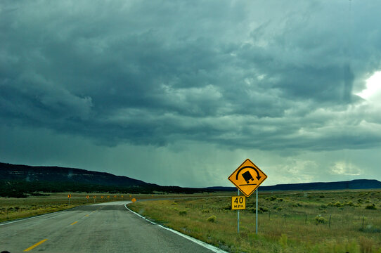 Storm and wet roads ahead. Tip-Over Warning for trucks on &ldquo;180 degree turn sign&rdquo; New Mexico State road 117