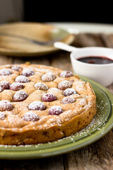 Grape Cake dusted with powdered sugar, grape syrup on green plate quick lunch