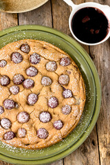 Grape Cake dusted with powdered sugar, grape syrup on green plate quick lunch