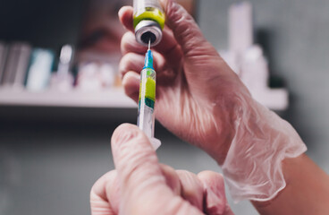 The doctor cosmetologist makes the biorepil facial injections procedure for tightening and...