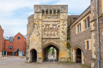 The Tudor West Gate into the historic medieval city of Winchester, with the main High Street in the...