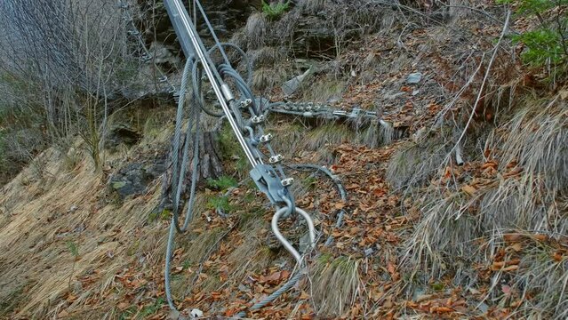 Rockslide Prevention Rockfall Safety Netting Supported by Metal Steel Wire Cable Anchored in Ground of Mountain Hill Slope
