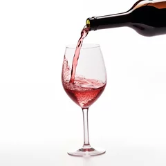Fotobehang A bottle of wine in the air is poured into a glass by itself, isolated on a white background © Yankowitz