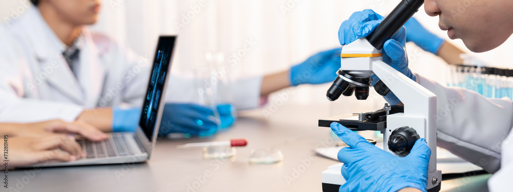 Poster dedicated scientist group working on advance biotechnology computer software to study or analyze dna