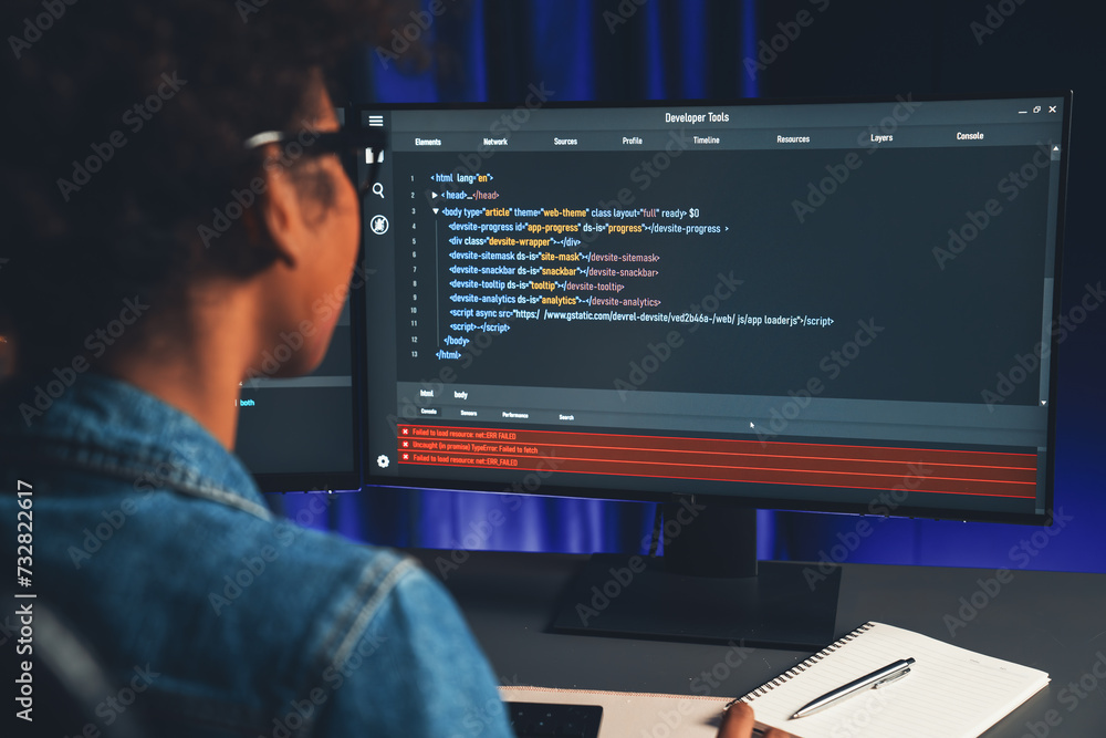 Poster young african american it developer concentrating on monitor screen laptop with codding program in d