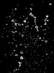 Obraz premium Shape form throw of Water splashes into drop water attack fluttering in air and stop motion freeze shot. Splash Water for explosion texture graphic resource elements, black background isolated