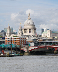 Fototapeta na wymiar Dome of St Paul's Cathedral rises over congested London scene