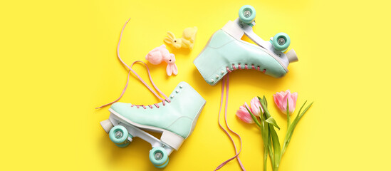 Vintage roller skates with beautiful tulips and bunnies on yellow background. Easter celebration