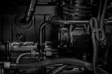 Black diesel engine. Fragment of a diesel motor close-up. Selective on the fuel injection in the the diesel engine. supply system for diesel fuel.  Engine details  Diesel engine  background