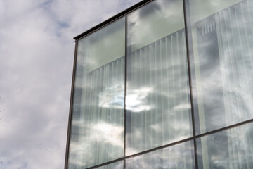 glass structure with window dressing sky and reflection on glass