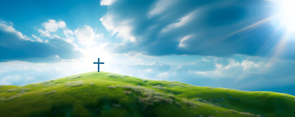 The Cross of Christ in a Green Field on a Sunny Day with White Clouds in the SKy - obrazy, fototapety, plakaty