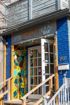 exterior facade entrance and sign of The Arch Caf&eacute;/Bar located at 293 Augusta Avenue in Kensington Market area in downtown Toronto, Canada