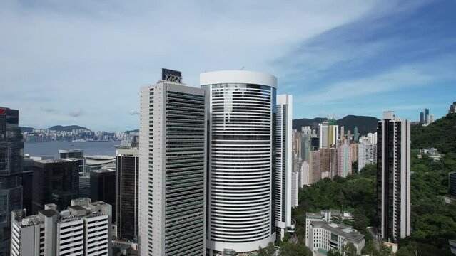 Aerial drone skyview of Hong Kong West Kowloon Victoria Harbour Financial Tsim Sha Tsui Hung Hom Central Admiralty Wan Chai Happy Valley Wong Nai Chung Stadium Tai Hang Causeway Bay Tai Hang