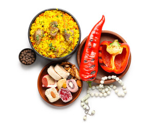 Traditional Eastern dishes and prayer beads on white background. Ramadan celebration
