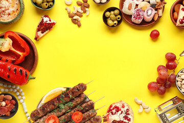 Frame made from traditional Eastern dishes on yellow background. Ramadan celebration