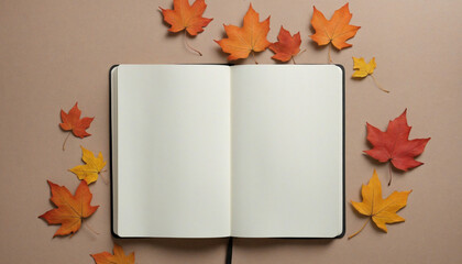 Opened notebook with pencil covered by maple leaves
