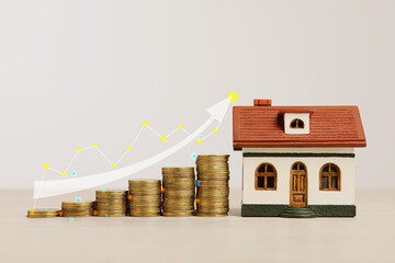 Mortgage rate. Model of house, stacked coins, graph and arrow