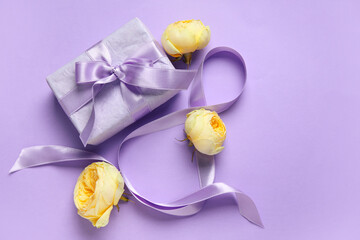 Composition with figure 8 made of ribbon, gift boxes and peony buds on purple background. International Women's Day celebration