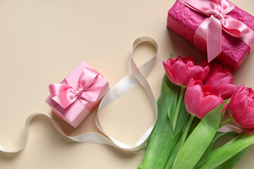 Composition with figure 8 made of ribbon, flowers and gift boxes on beige background. International Women's Day celebration
